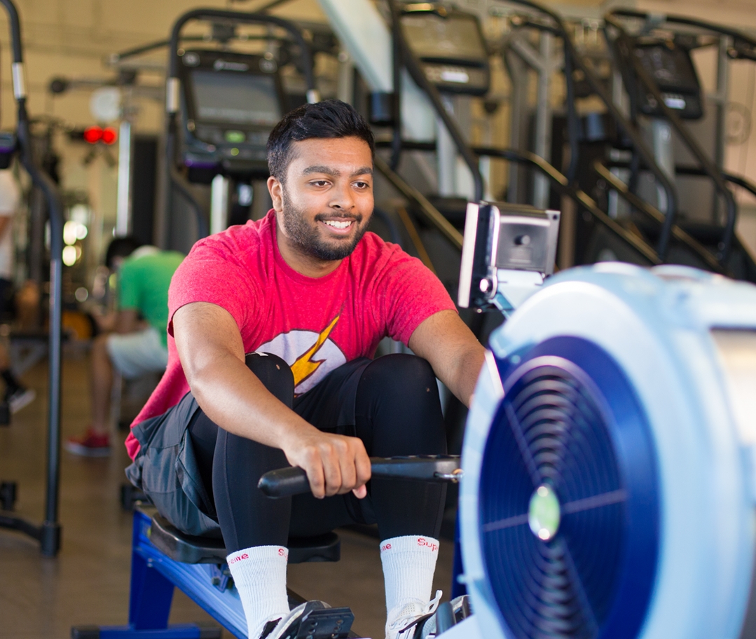 Man smiling on the rowing machine