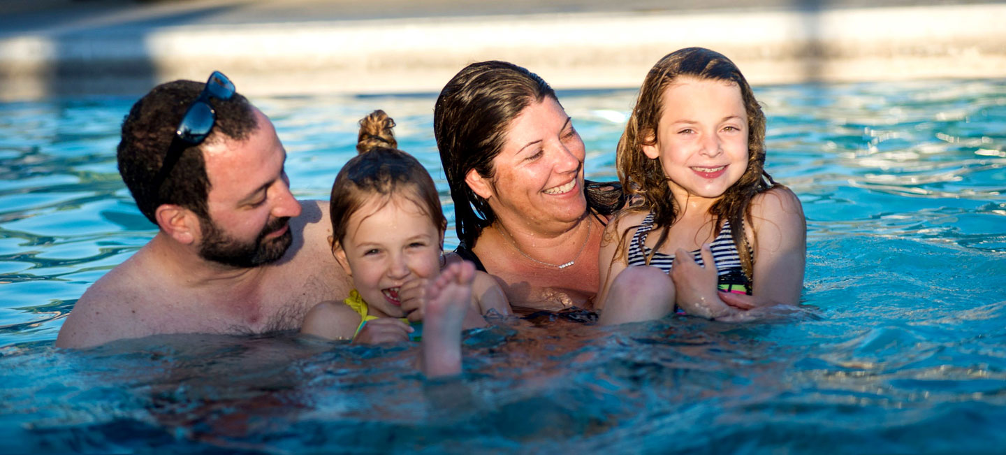 Family together in a swimming pool