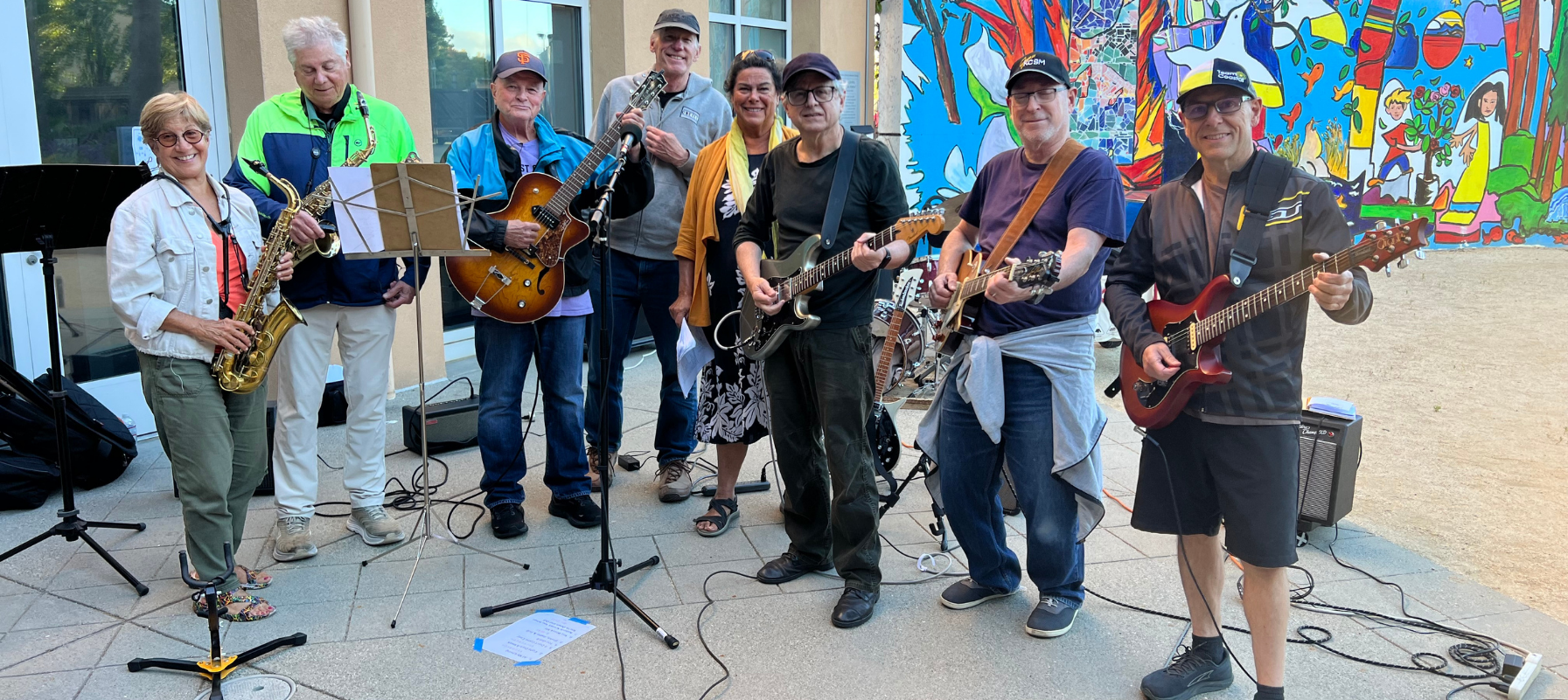 Members of the PJCC Rock Music Players group standing with their intstruments