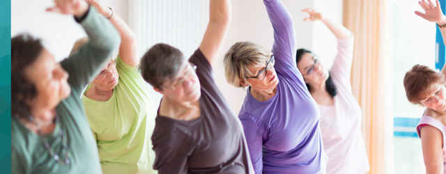 Group of women stretching in a group exercise class